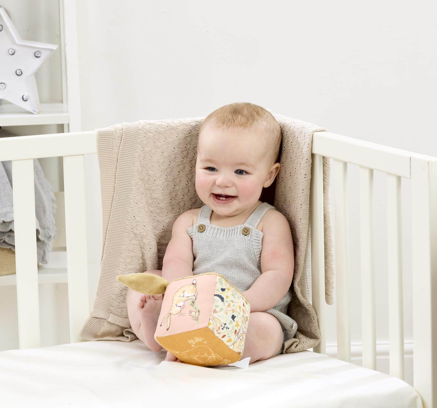 Baby playing with the Guess How Much I Love You Activity Cube