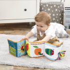 Baby exploring the Unfold & Discover soft book