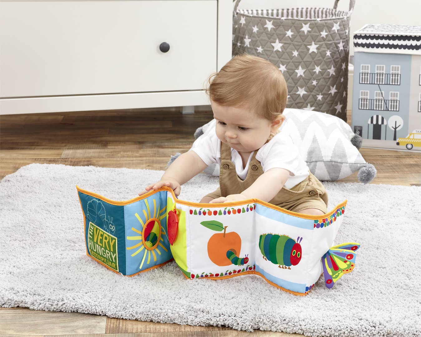 Baby exploring the Unfold & Discover soft book